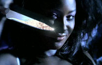 Gallery image from movie. Crazy girl with a knife.