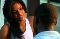 Gallery image from movie. A woman flirting with a man.
