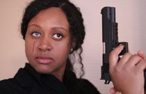 Gallery image from movie. Woman with gun.