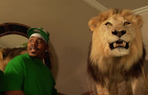 Gallery image from movie. A man and a lion.