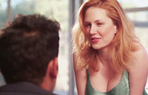 Gallery image from movie. A sexy redhead flirting.