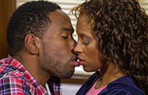 Gallery image from movie. Couple kissing.
