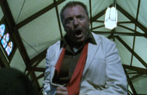 Gallery image from movie. A man yells.
