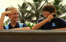 Gallery image from movie. A boy and girl make a promise to save the turtle eggs.