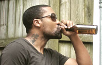 Gallery image from movie. A man drinking a beer.
