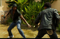 Two of the assassins fight.
