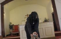 Tish knocks Andrew out and drags him into a church.