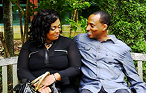 Husband and wife talk in the park.