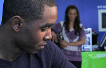 Gallery image from movie. A guy looks over his shoulder.